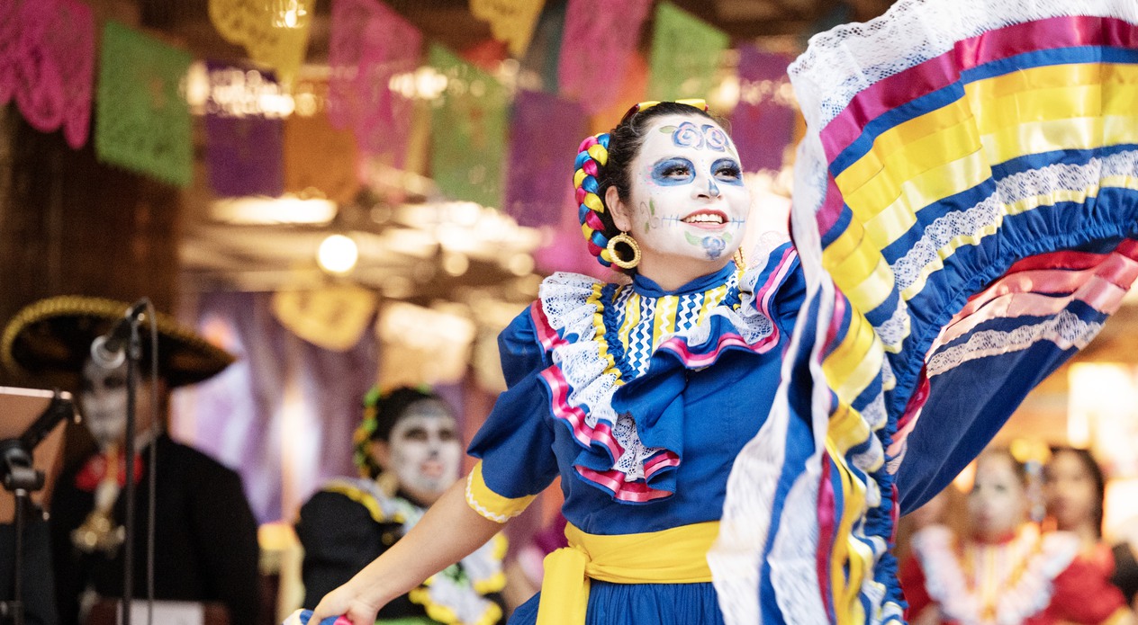 Woman dancing in colorful dress