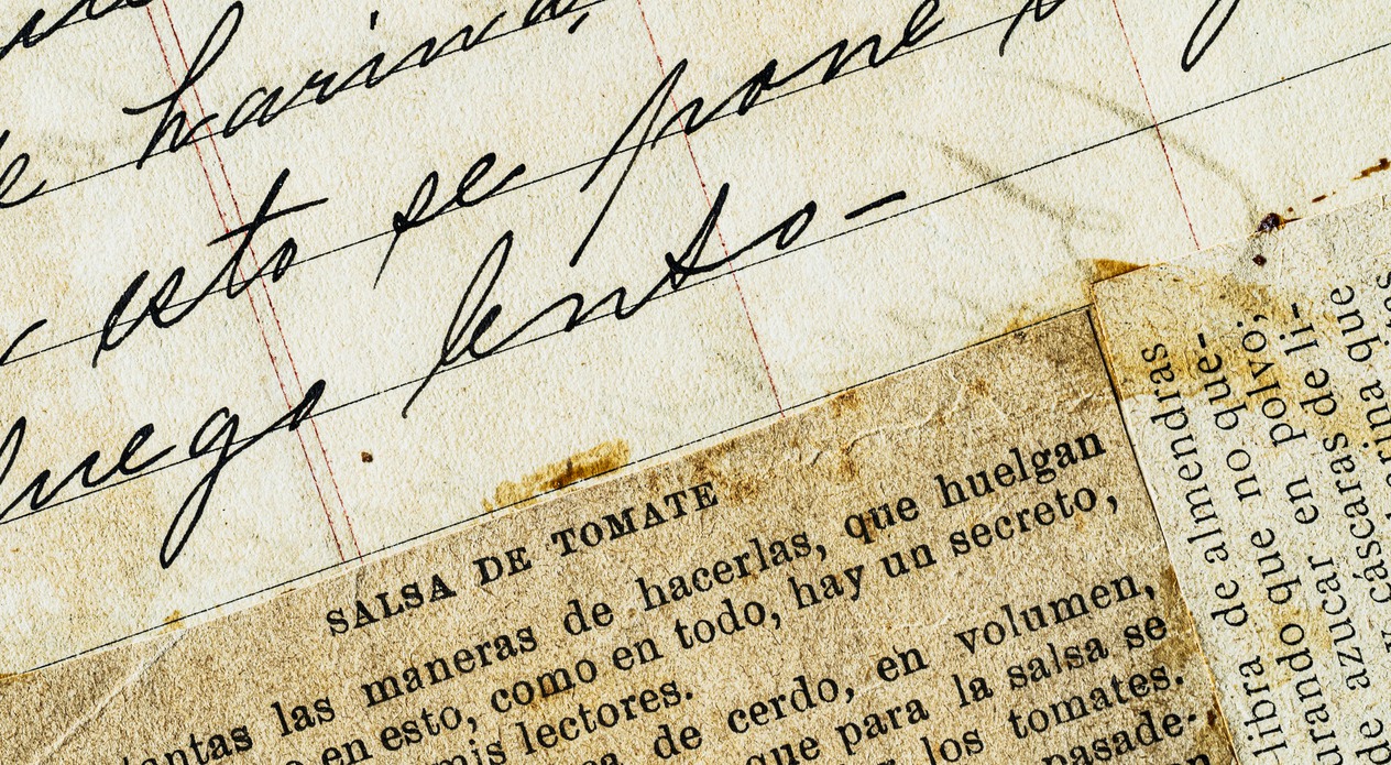 Background themes: Close up of handwriting Spanish calligraphy on aged recipe book sheet